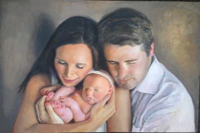 family portrait of woman,man and new born baby